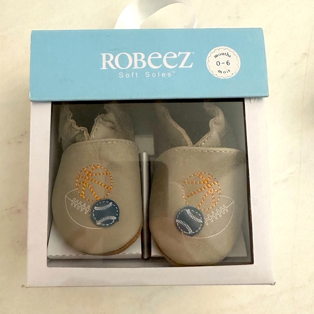 Brand new Robeez 0-6 month soft sole shoes